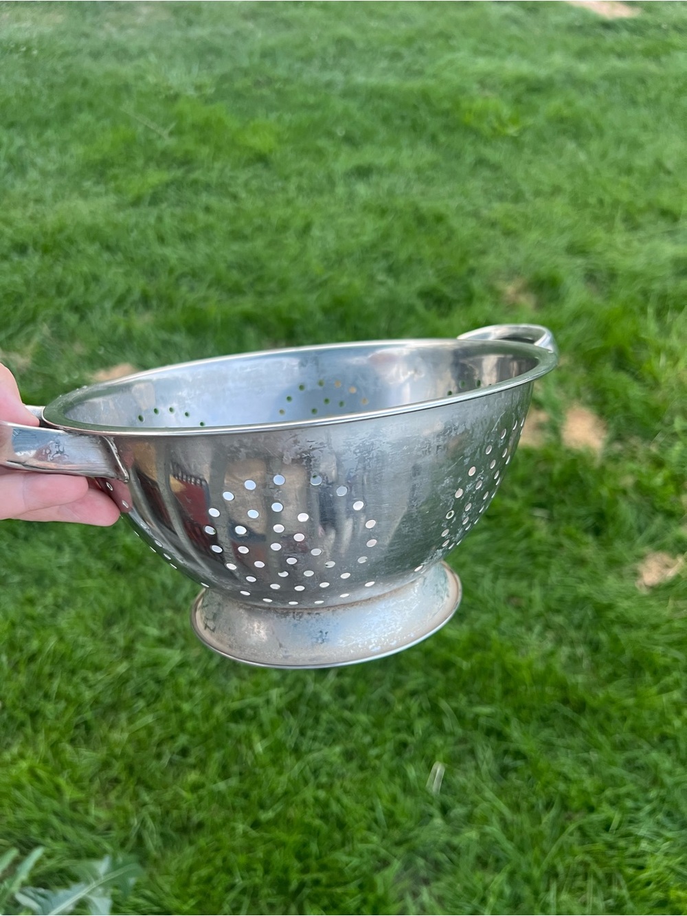 vintage footed aluminum kitchen colander featuring